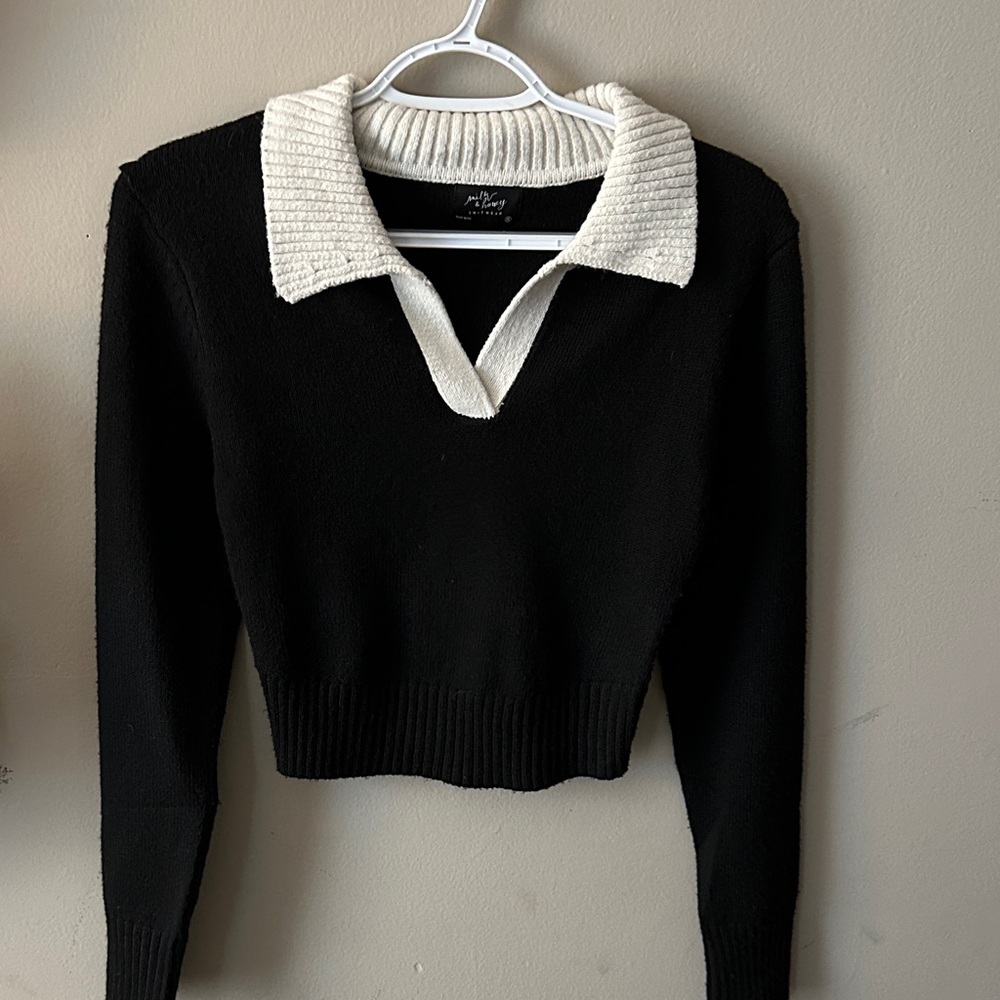 Chic Black and White V-Neck Sweater by Milk and Honey.